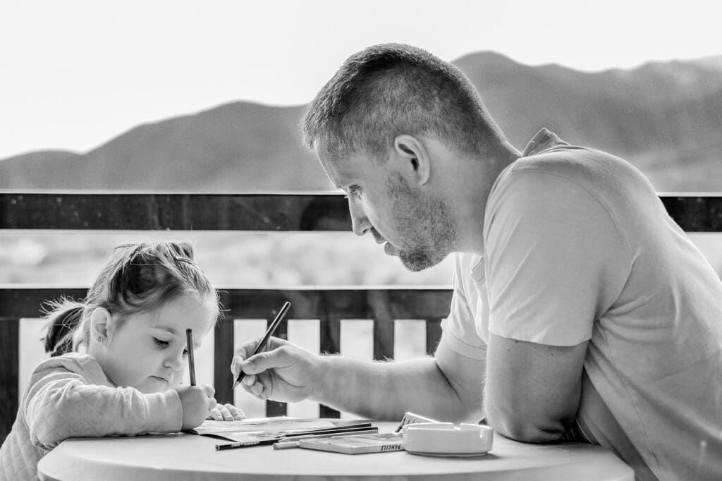 Father doing homework with daughter